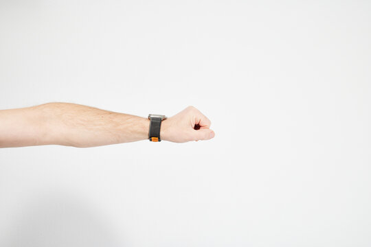 Male hand on white background with watch