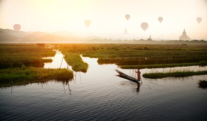 Boarding tourists Hot weather, balloon watching morning nature and fishermen on Inle Lake in Shan...