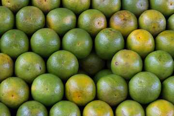 Stack of oranges, symmetrically arranged on market. Brazil