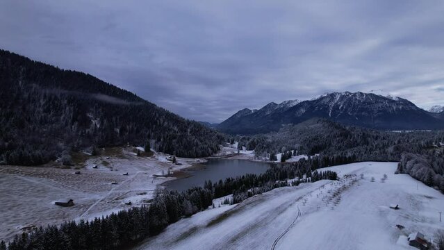 DRONE AERIAL FOOTAGE: The Lake Geroldsee and the Karwendel mountains, the largest mountain range of the Northern Limestone Alps, near Garmisch-Partenkirchen and Mittenwald, Krun, Bavaria, Germany.
