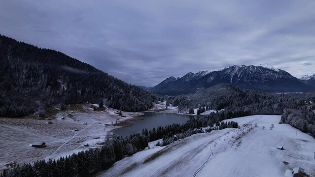DRONE AERIAL FOOTAGE: The Lake Geroldsee and the Karwendel mountains, the largest mountain range of the Northern Limestone Alps, near Garmisch-Partenkirchen and Mittenwald, Krun, Bavaria, Germany.