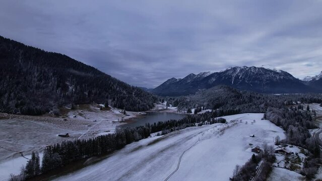 DRONE AERIAL FOOTAGE: The Lake Geroldsee and the Karwendel mountains, the largest mountain range of the Northern Limestone Alps, near Garmisch-Partenkirchen and Mittenwald, Krun, Bavaria, Germany.