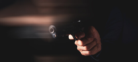 man holds a gun in his hands and threatens