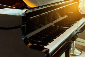 Piano keyboard background with selective focus. Warm color toned image © Kiimura