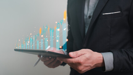 trading stock or derivative, business man using tablet and stylus for searching and trading stock...