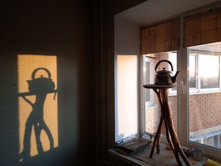 silhouette of a person in a room
