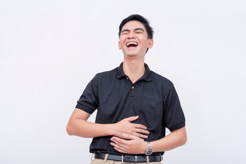 A young man bursting into a fit of laughter. A asian person having fun. Laughing so hard his stomach hurts. isolated on a white background.