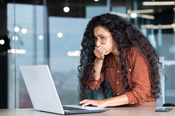 Businesswoman has severe nausea, latin american woman at work sick, working sitting at table with...