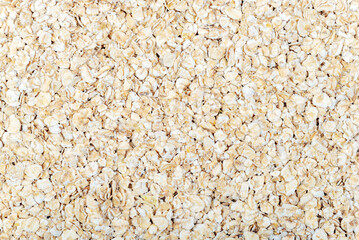 Oat flakes texture, background. Healthy porridge background