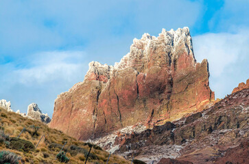 Completely rock mountain with ice at the tip of magical colors