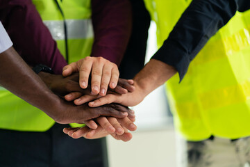 Workers and engineers work together to build a successful project. teamwork concept Collaboration with partners and engineering tools in the workplace or construction site