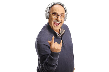 Mature man with headphones gesturing a rock and roll sign