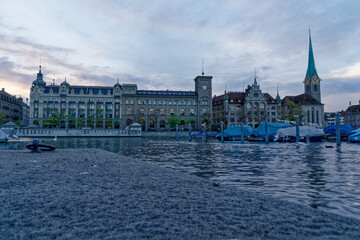 Fototapeta premium Famous church Women's Minster with town hall at the old town of Zürich on a cloudy autumn late afternoon. Photo taken November 4th, 2022, Zurich, Switzerland.
