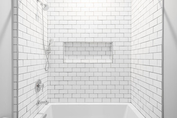 Modern and Minimal Clean White Bathroom. White Subway Tile Shower with Stainless Steel Hardware. 