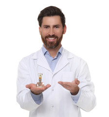 Dentist holding educational model of dental implant on white background