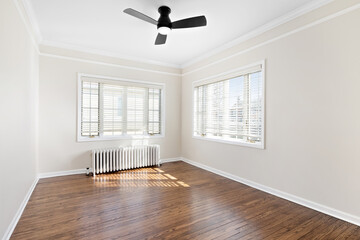 Clean and Bright Vacant Room. Vintage room with antique radiator. Empty room for virtual staging with natural light.