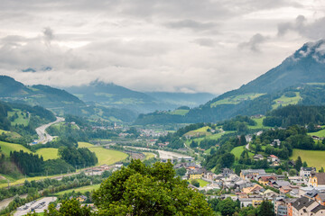 Fototapeta na wymiar View over the Salzach river valley near town of Werfen, Austria on a cloudy rainy day.