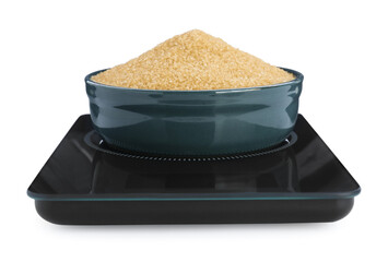 Modern kitchen scale with bowl of brown sugar isolated on white