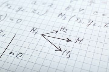 Sheet of paper with different mathematical formulas, closeup