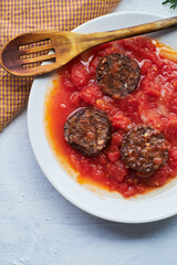 Spanish blood sausage with tomato