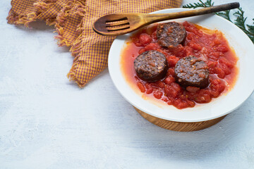 Spanish blood sausage with tomato