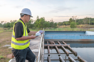 Obraz na płótnie Canvas Environmental engineers work at wastewater treatment plants,Water supply engineering working at Water recycling plant for reuse