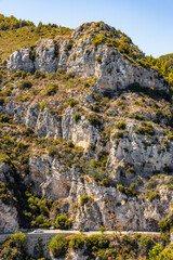 Panoramic view of Alpes rocky coastline with Avenue Bella Vista route on Azure Cost of Mediterranean Sea seen from historic town of Eze in France