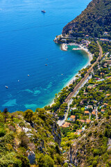 Panoramic view of Eze Bord de Mer and Silva Maris yacht port seen from historic town of Eze rising...