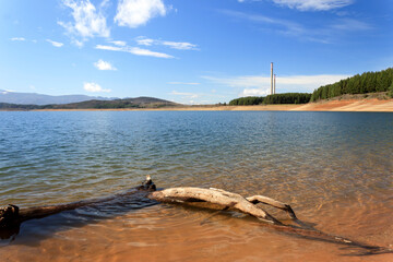 The Barcena reservoir with the chimneys of Compostilla thermal power station at background in...