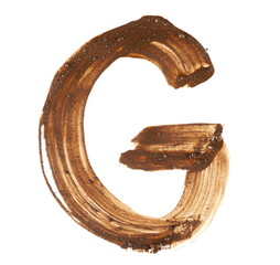 Wet mud alphabet, brush stroke letter G isolated on white, clipping path