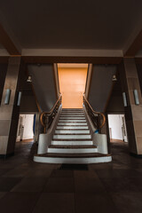 Fototapeta premium imposing hallway with a stairway in a lost place