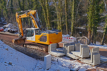 Precast concrete elements and accessories for setting bored piles in snow on a construction site in Halle an der Saale