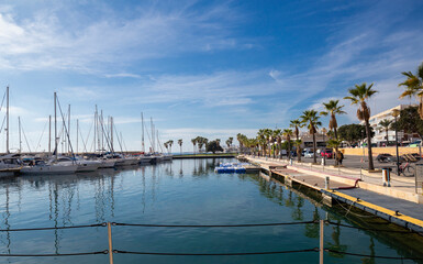 Fototapeta premium Mediterranean sea coast in the resort town overlooking the promenade and harbor with yachts, province of Alicante,Villa Hoyosa, Costa Blanca, Spain
