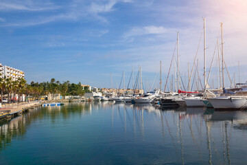 Fototapeta na wymiar Mediterranean sea coast in the resort town overlooking the promenade and harbor with yachts, province of Alicante,Villa Hoyosa, Costa Blanca, Spain