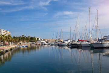 Fototapeta na wymiar Mediterranean sea coast in the resort town overlooking the promenade and harbor with yachts, province of Alicante,Villa Hoyosa, Costa Blanca, Spain