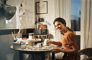 portrait of a young decorator in her studio