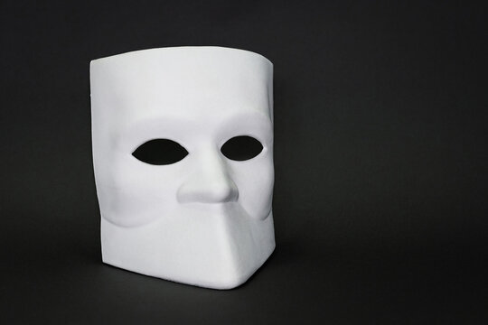 Venice Mask Bauta, Casanova mask on dark background. Concept - Venice carnival-masquerade, festival, travels, holiday. Copy space. Close-up...