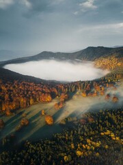 Morning clouds over mountain lake during autumn. Saint Anne Lake is the only one crater lake from Romania, Transylvania.