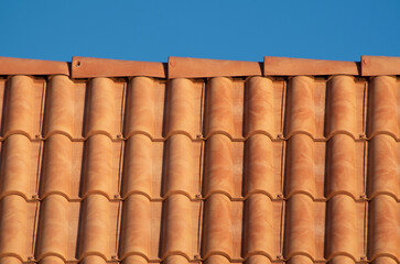New roof with colorful plastic tiles close