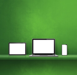 Laptop, mobile phone and digital tablet pc on green wall shelf. Square background