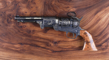 pirate pistol on wooden background