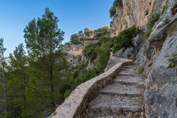 Fototapeta na wymiar Ancient stone steps hewn into mountain leading to Castell Alaro on island of Mallorca/Majorca