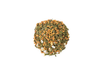Green tea Japanese Genmaicha. Green tea mixed with roasted popped brown rice heap isolated on white background.
