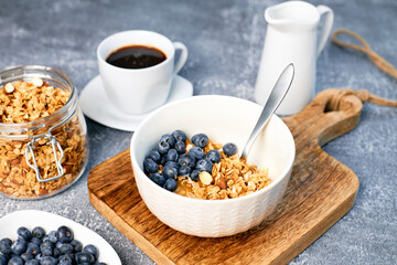 Granola with nuts and a cup of coffee for breakfast. Balanced diet for vegetarians or vegans