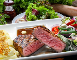 sliced grilled steak served , Picanha