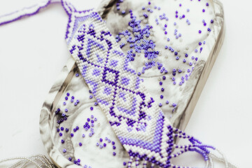 Geometric pattern on the gerdan ornament, Ukrainian beaded ornament, amulet.