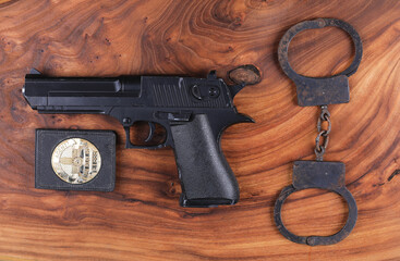 police pistol on wooden background