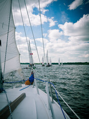 Fototapeta premium Sailboat approaching a regatta squad