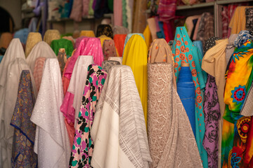Colourful fabrics for sale in a market in Phuket Town