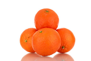 Several sweet organic tangerines, macro, isolated on white background.